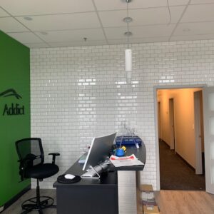 Commercial wall tile installation - white tile